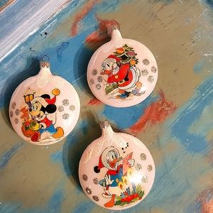 Set of three Disney christmas ornaments.